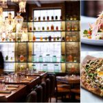 Upscale bar interior with hanging lights and shelves, alongside vibrant salad and pizza.