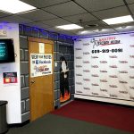 Escape room entrance featuring a large promotional banner and themed decor.