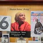 Portrait of artist Khalilah Sabree displayed next to her artwork and promotional materials.