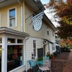 Yellow clapboard diner with "Aunt Chubby's" sign and outdoor seating area.