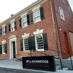 Historic brick building housing the Princeton University Art Museum, featuring large windows and black shutters.