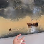 Oil painting of a wooden sailing ship on calm, atmospheric water under dramatic clouds.