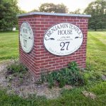 Brick sign for Benjamin Temple House, displaying the number 27 and historical details.