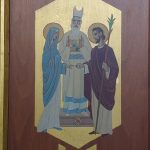 Icon panel depicting three figures: a woman, a bishop in vestments, and a bearded man with a staff.