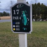 Golf course sign showing hole 17, Par 4, with distance markers in miles.