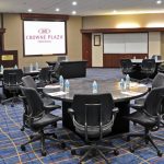 Conference room setup at Crowne Plaza Princeton with tables and chairs.