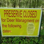 Yellow sign warns "PRESERVE CLOSED for Deer Management on the following dates."