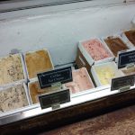 Ice cream flavors displayed in a freezer case, including Mocha Chip and Coffee Ice Cream.