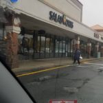 SaladWorks storefront visible from a vehicle on a cloudy day.