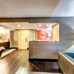 Hotel lobby reception desk with modern design and warm lighting.