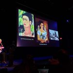 Projection of artwork on a screen during a presentation or screening event.