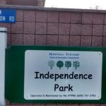 Hopewell Township Independence Park sign on a brick building with street address visible.