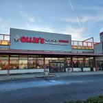 Ollie's Bargain Outlet store exterior under a bright, partly cloudy sky.