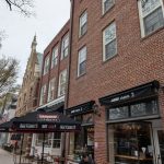 Brick building housing "Jammin' Crepes" storefront on a cloudy day.