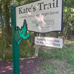 Sign for Kate's Trail, honoring Katherine Wright Gorrie, with parking information.