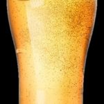 Tall glass of golden beer topped with a thick, white foamy head.