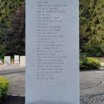 Vietnam Service Medal memorial stone outdoors with trees in the background.