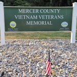 Mercer County Vietnam Veterans Memorial sign in front of a gravel memorial area.