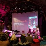 Concert performance on a stage with large screen displaying "Morir Sonyando."