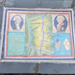 Historical plaque showing a map of Yorktown and portraits of Louis XVI and Rochambeau.
