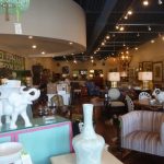 Elephant decor and interior design showroom with white elephant statues on display.
