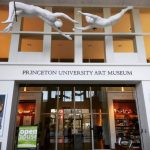 White abstract sculptures suspended above the entrance to Princeton University Art Museum.
