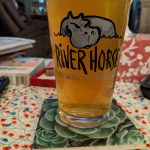 River Horse Brewing Co. beer in a glass on a patterned tablecloth.
