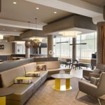 Modern, open-plan lounge area with comfortable seating and contemporary design elements.