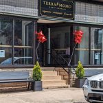 Terramomo Bread Company storefront with large windows and red star decorations.
