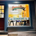 Thomas Sweet ice cream shop window displaying "ICE CREAM CAKES" sign.