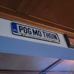 Sign in Irish language reading "Póg mo thoin" with a political slogan.