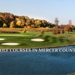 Golf course view in Mercer County with green fairways, bunkers, and a body of water.