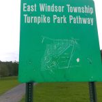 Green sign for East Windsor Township Turnpike Park Pathway with a map graphic.