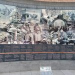Historical mural depicting European, African, and Middle Eastern campaigns of World War II.